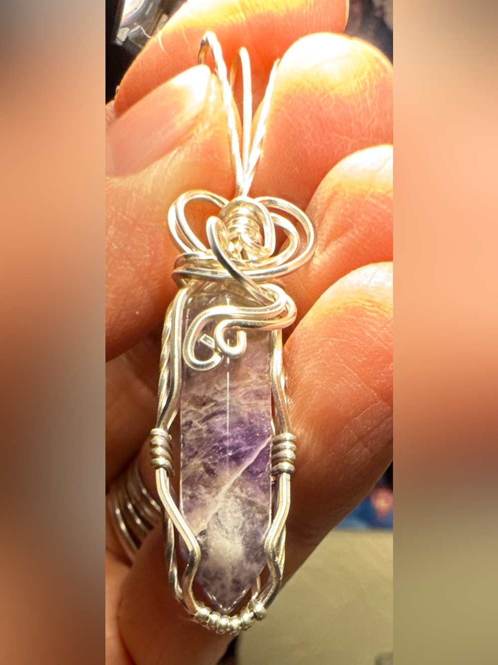 Small, delicate Chevron Amethyst pendant in jewelers grade silver wire wrap